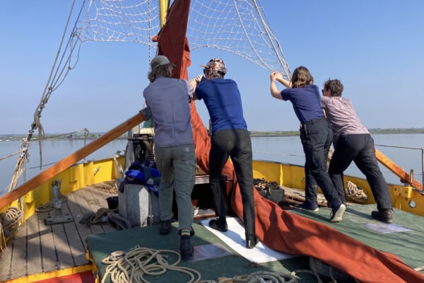 Crew sweeping on SV Blue Mermaid