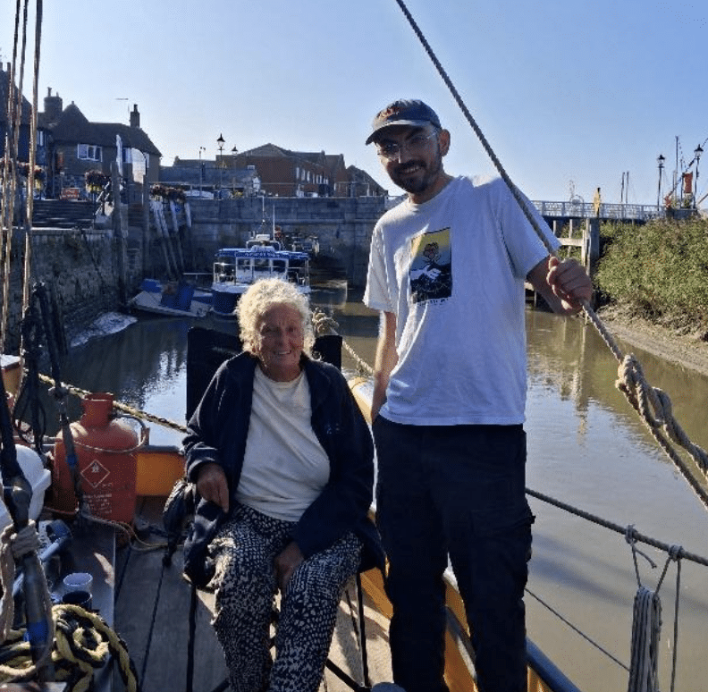 Photo of Ben Ricini with Hilary onboard Blue Mermaid